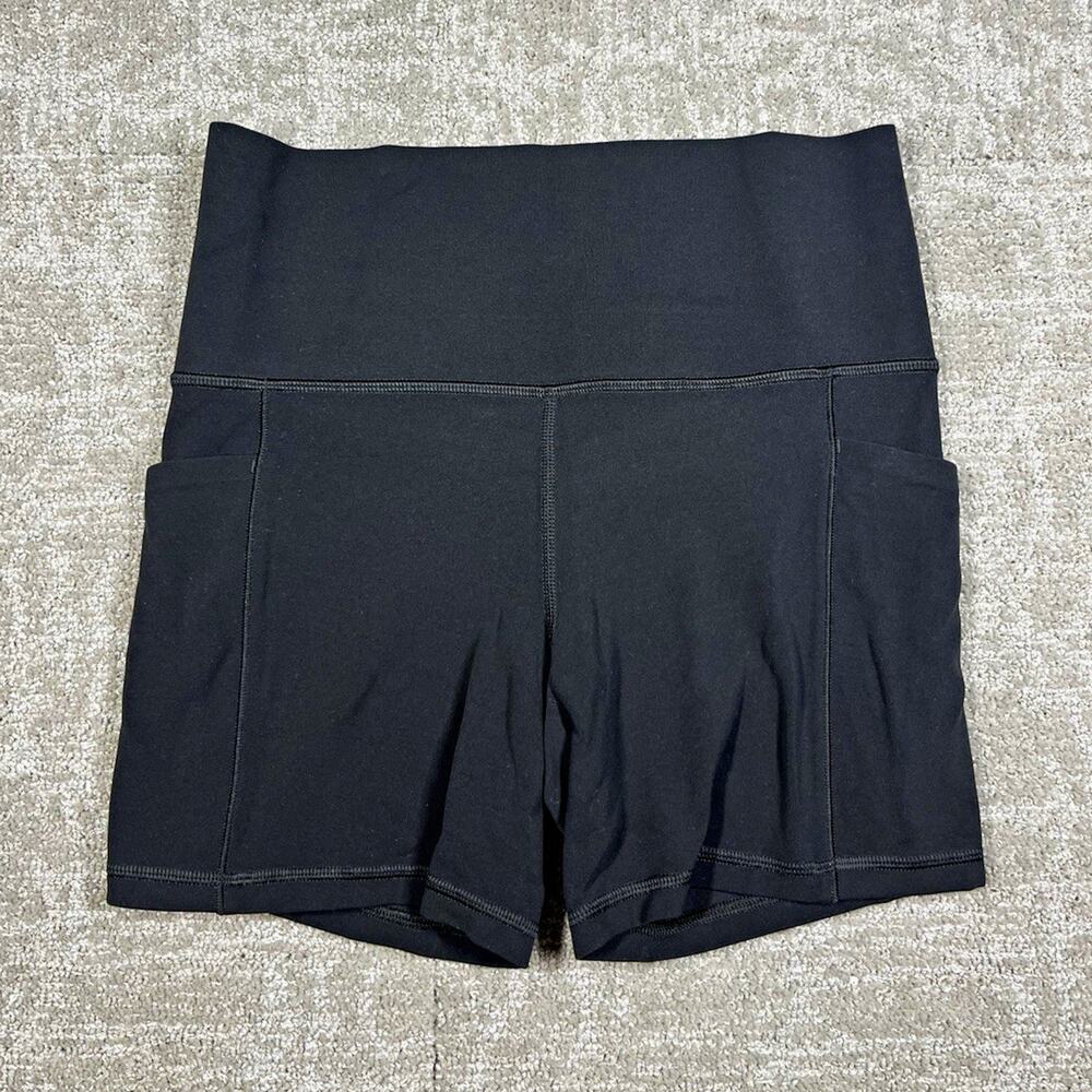 Athleta Salutation Stash Pocket II Womens Black 5" Shorts Pockets Stretch S
